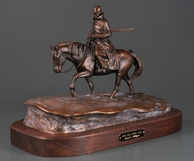 Man riding horse through snow