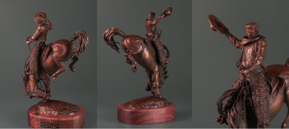 sculpture of cowboy on bucking horse