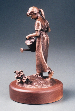 sculpture of girl watering flowers.